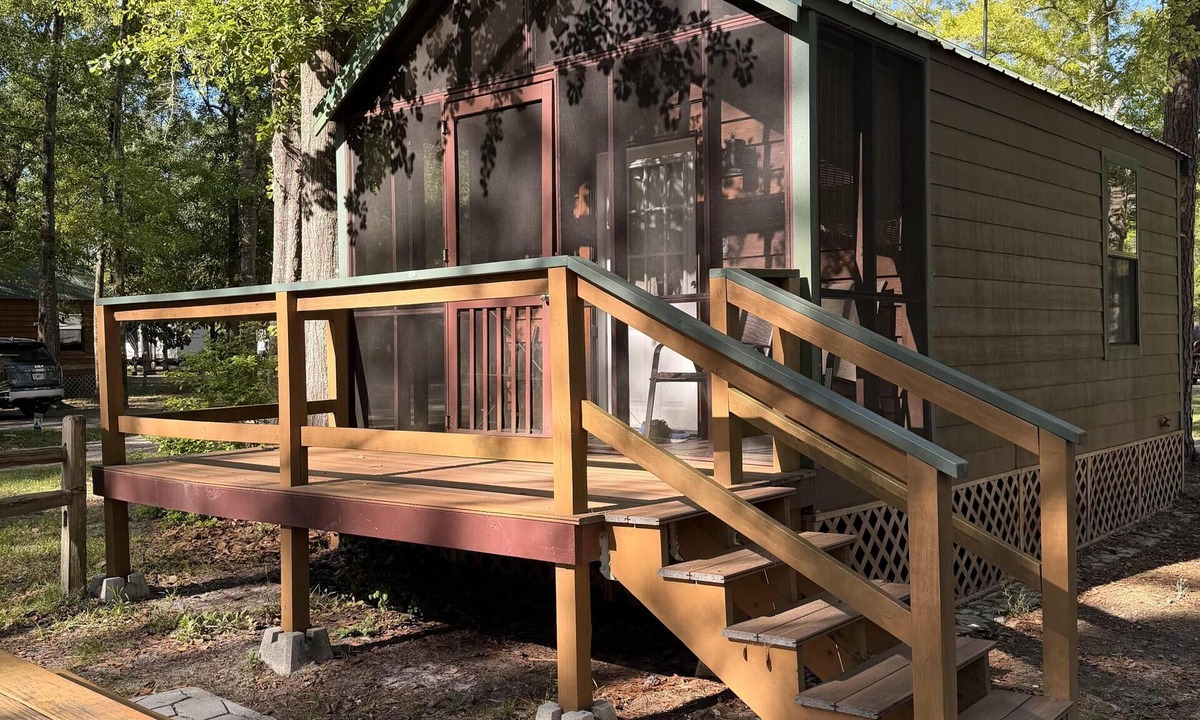 Folkston Cabin | Deluxe Cabin - The Gator Hole - Our Deluxe Cabins offer comfort with a true Okefenokee feel. Climate controlled, private, and set in a quiet part of the campground.
