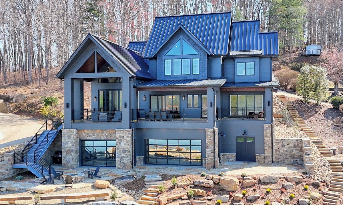 Elf House | Endless Sunsets by Chatuge Home Concierge | Lakefront home with private dock, covered boat slip, sun deck, hot tub, bar, fire pit, pool table, kayaks and EV charger. The perfect spot to relax, play, and enjoy unforgettable sunset views.