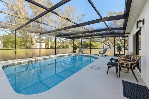 Spring Hill House | Luxury getaway, relax, and recharge! Tropical Florida Getaway Heated Pool Extra Fee