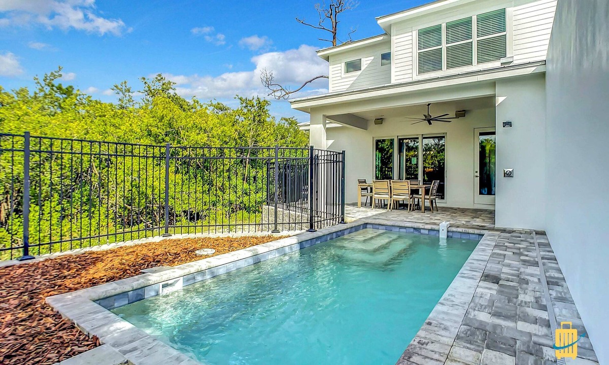 New Smyrna Beach House | New duplex, pool, dock, 2 blocks from Flagler