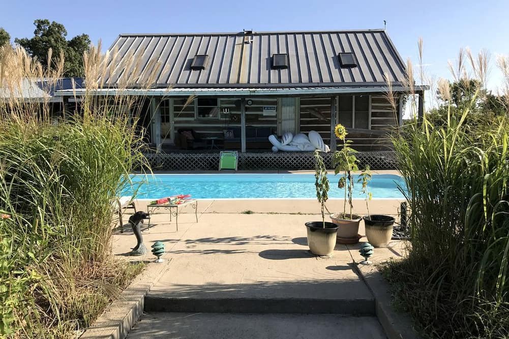 Crofton Cabin | Pet-Friendly Log Cabin with an Outdoor Pool near Crofton, Kentucky