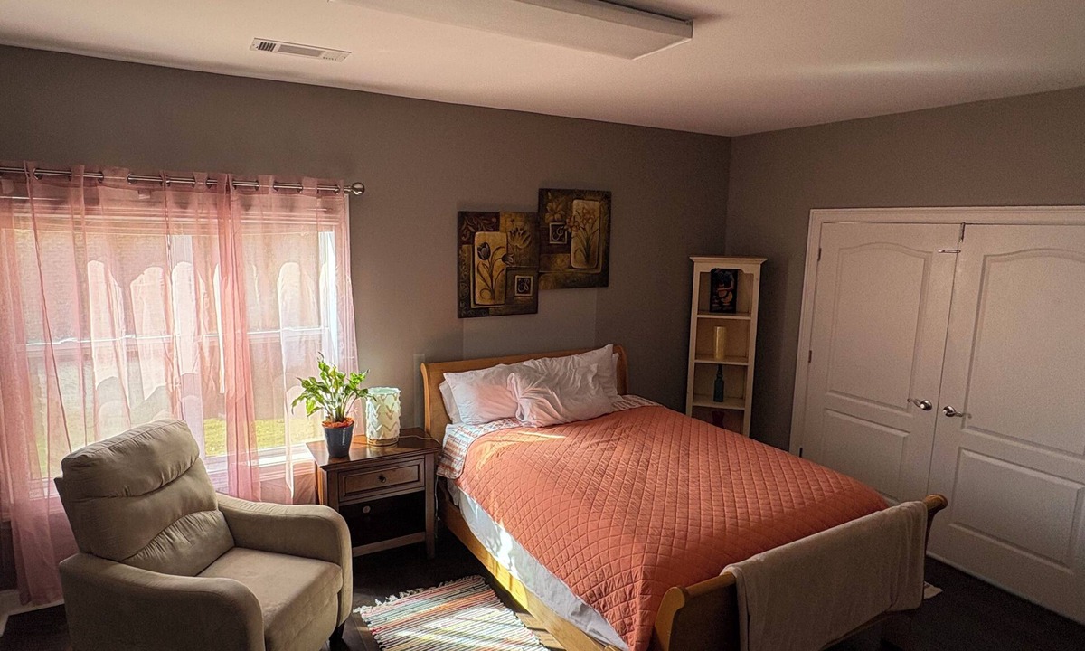Braselton Apartment | Spacious bedroom with closet, tv and full bed, along with apartment amenities.