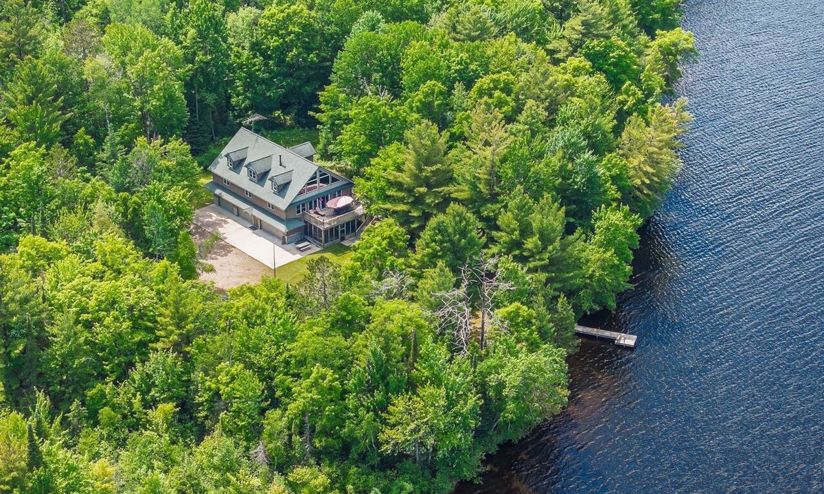 Tomahawk House | Spacious Lakefront Retreat with Dock & Canoes