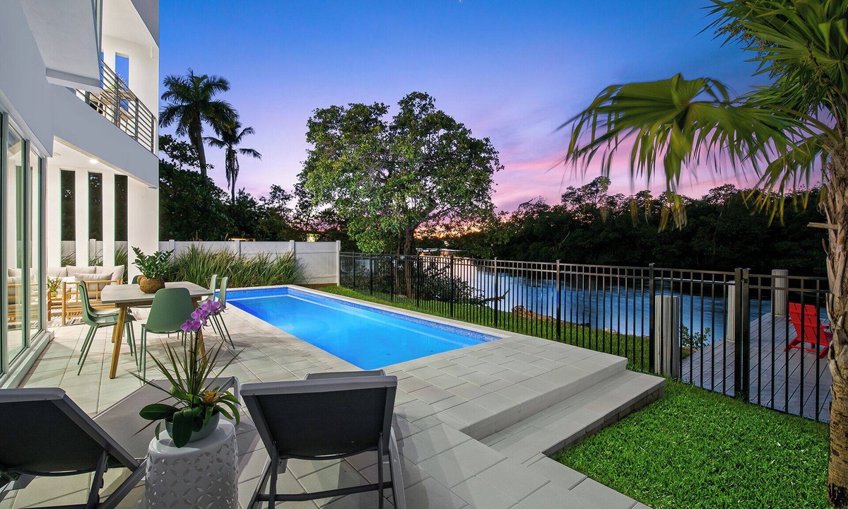 Middle River Terrace House | The Riverhouse – A Stunning Modern Heated Pool Retreat with Serene and Scenic Waterway Views!