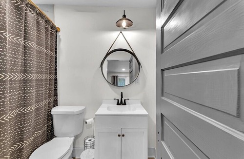 Summerville House | 1 bed 1 bath home that sleeps max 4 guests with sleeping arrangements being a queen bed and a fold out couch that is queen sized.