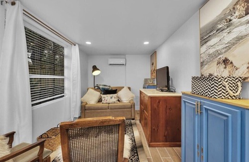 Summerville House | 1 bedroom, 1 bathroom sleeps max 4 guests with the sleeping arrangements being a king bed and futon that sleeps 2
