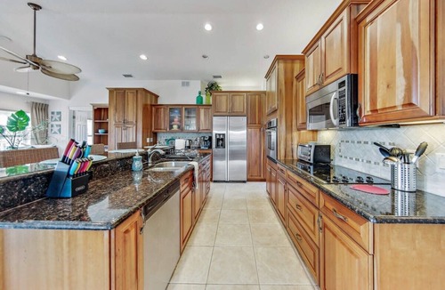 Marineland Acres House | Beach Home with Amazing Oasis Pool, Spa, Waterfall, Fire Pit, Bikes