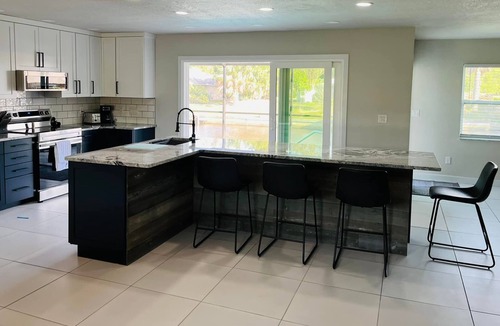Harbour Heights House | Beautifully updated home on canal with heated pool - no additional charge.