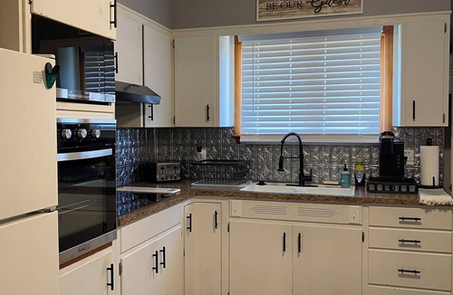Atchison House | Charming 2-bedroom house on quiet brick and tree lined street.