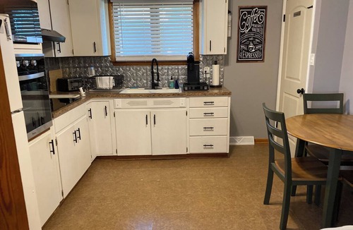 Atchison House | Charming 2-bedroom house on quiet brick and tree lined street.