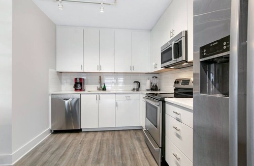 Central Business District Hotel | Chic Elegance in the Heart of NOLA: 4-Bedroom Oasis Awaits!