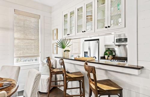 Cottage District House | Cozy Cottage with Porches for Lounging