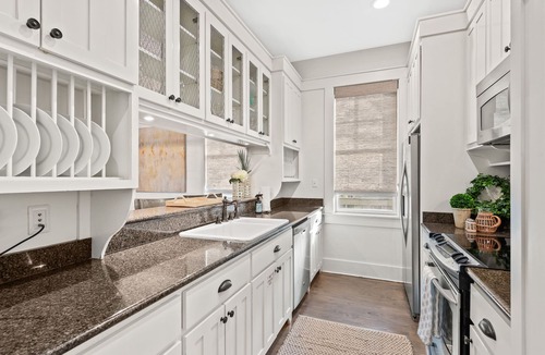 Cottage District House | Cozy Cottage with Porches for Lounging