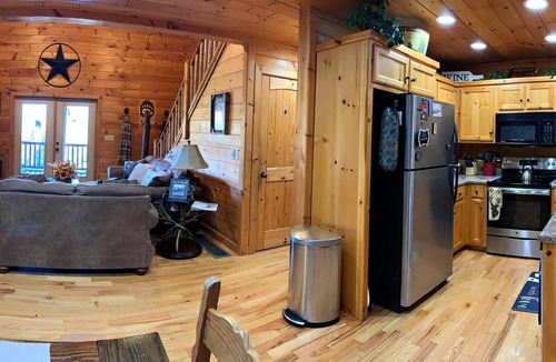 Ridgeline Vistas Cabin | Cozy mountain views, 4 king beds, hot tub, game room, fire pit, porch fireplace