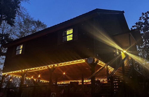 Hattiesburg House | Creek-side getaway, big deck, easy access to the city while being off the grid!