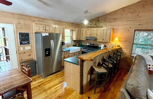 Madisonville Cabin | Creekfront Cabin with Waterfall. Hot Tub, Fire Pit, Gameroom, and more.