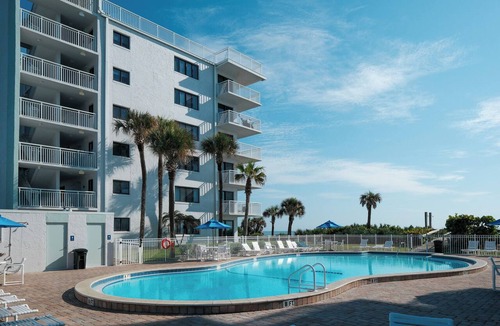 New Smyrna Beach Condo | Direct oceanfront corner 3/2 with a large wrap around balcony and heated pool