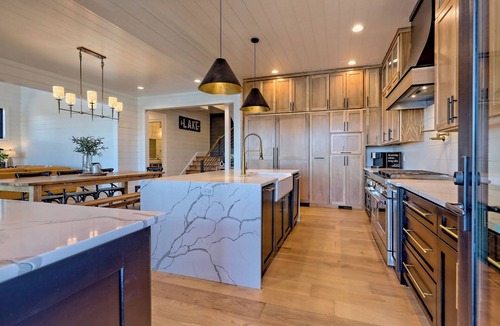 Elf House | Endless Sunsets by Chatuge Home Concierge | Lakefront home with private dock, covered boat slip, sun deck, hot tub, bar, fire pit, pool table, kayaks and EV charger. The perfect spot to relax, play, and enjoy unforgettable sunset views.