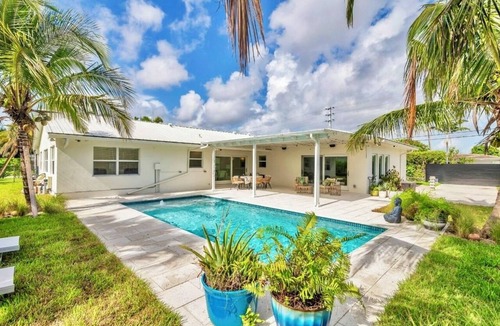 Lake Clarke Shores House | Fully upgraded waterfront pool home, centrally located in West Palm Beach!