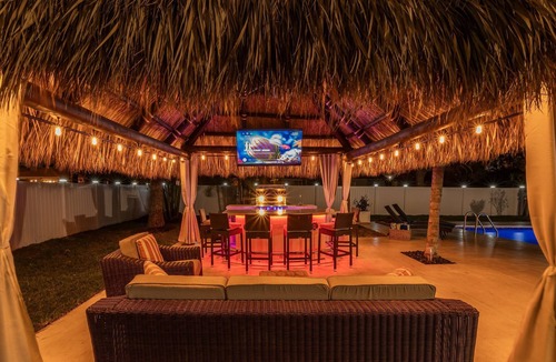 Boynton Beach House | Golfers Green Retreat with 35' Heated Saltwater Pool & Tiki. Pet Friendly!