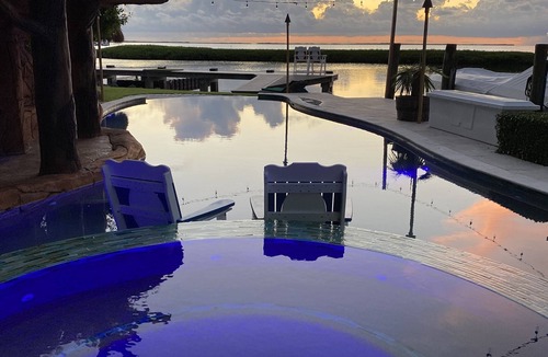 Key Largo House | House and guest house with Boat dock, sunsets, jacuzzi, pool, slide, tiki, etc
