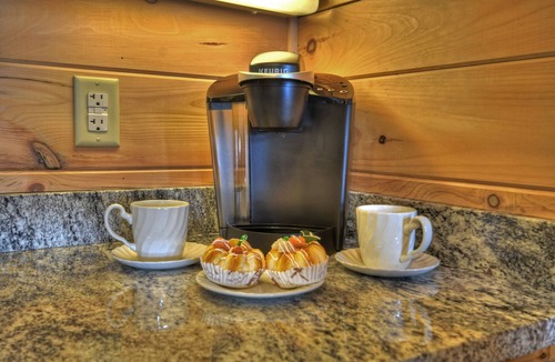 Chatsworth Cabin | Hummingbird Haven is the ultimate retreat for large groups! Enjoy pet-friendly accommodations, breathtaking mountain views, a hot tub, firepit, WiFi, and hiking