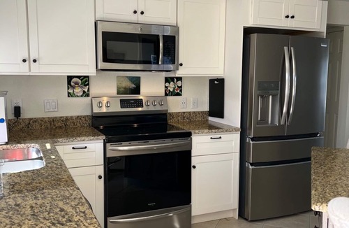 Saint James City House | Immaculate Waterfront Home With Heated Pool. Pet Friendly.