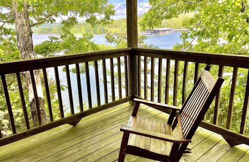 Mount Ida Cottage | Lake view three bedroom, three bath log-sided cottage with private hot tub overlooking Lake Ouachita. by RedAwning