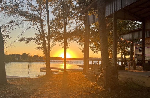 Lincoln RV Rental | Lakeside Comfort: Covered RV Site with Private Pier #1