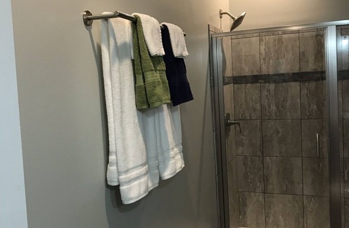 Travelers Rest House | Light and airy contemporary guest house with private deck and parking.