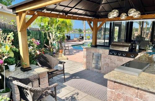Orlando Villa | Luxurious Waterfront Retreat 4BR 3BA with Pool & BBQ