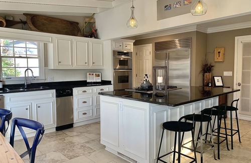 Roswell House | Luxury stay on a lake open plan huge kitchen games rm bar firepit luxury bedding