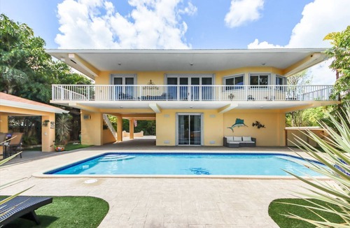 Twin Lakes House | Luxury Water Front Home, Private Pool, Spa, Tiki Bar, 75' Foot Dock with Kayaks