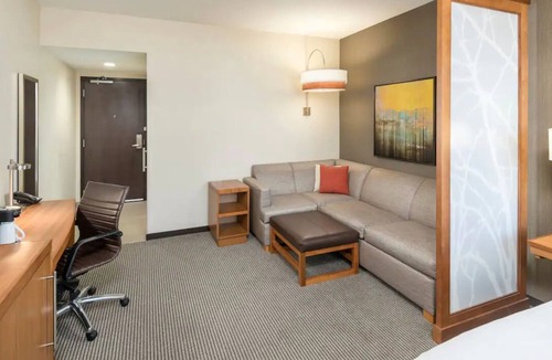 Greenville Downtown Apartment | Modern King Room | Downtown Location, Pool & Beach Access