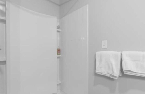 Central City Apartment | Modern loft with rooftop deck, fitness center, and private parking.