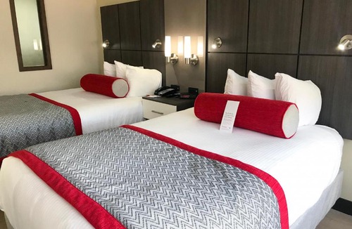 Airport North Hotel | Ramada by Wyndham Suites Orlando Airport- Free Airport Shuttle