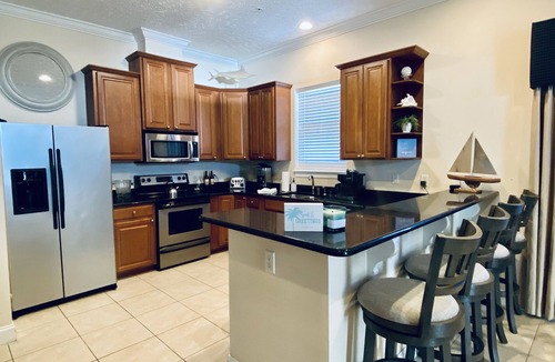 Bahama Beach Condo | Remodeled 3 BR 2BA condo steps to the beach! Sunset views and private garage.