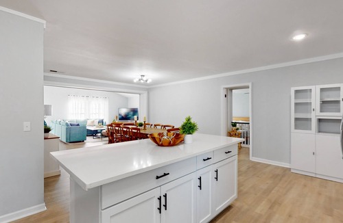 Shell Point House | Remodeled cozy ocean themed home with outdoor seating & firepit