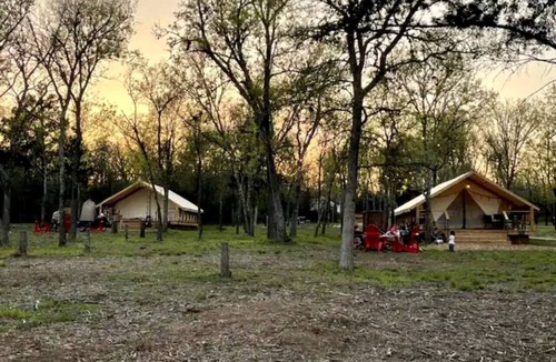 Bastrop RV Rental | Romantic Lakefront Safari Tent with Fire Pit and Peaceful Views near Bastrop, Texas