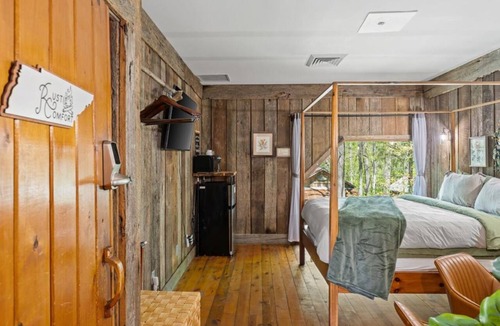 Townsend Hotel | Rustic Comfort Room - Wood Paneling and Fireplace