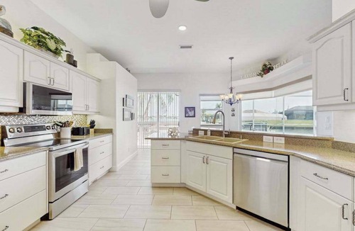 South Gulf Cove House | Serene and elegant with heated pool, water views, family and dog friendly, W/D
