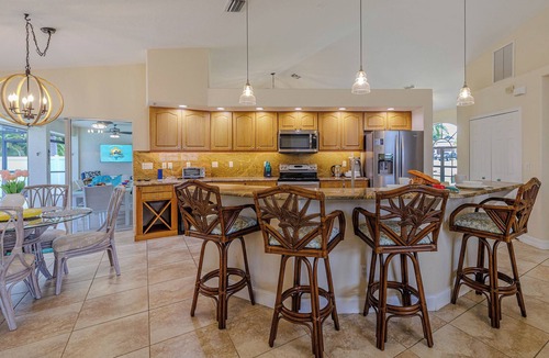 Caloosahatchee Villa | Sleeps up to 10 - game room - pool with hot tub - Stars Vacation Rentals