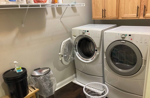 Braselton Apartment | Spacious bedroom with closet, tv and full bed, along with apartment amenities.
