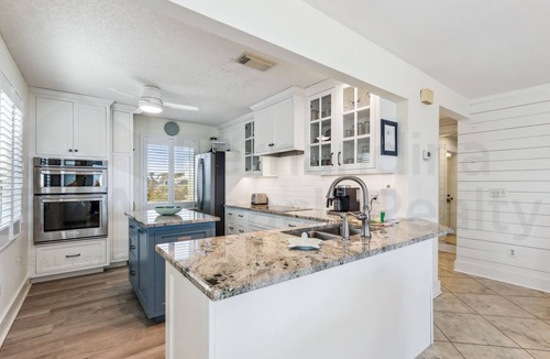 Fernandina Beach House | Spacious living area, windows across entire length of home.