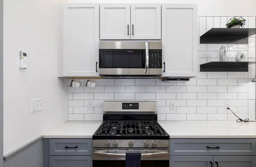 Central City Condo | Stylish Birmingham Loft + Rooftop Lounge