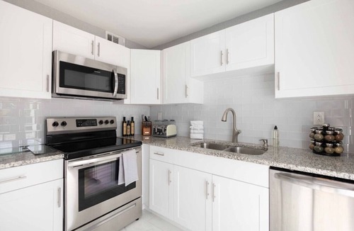 Greenacres Villa | Sunshine Retreat! New! Sparkling Blue Pool And Spa