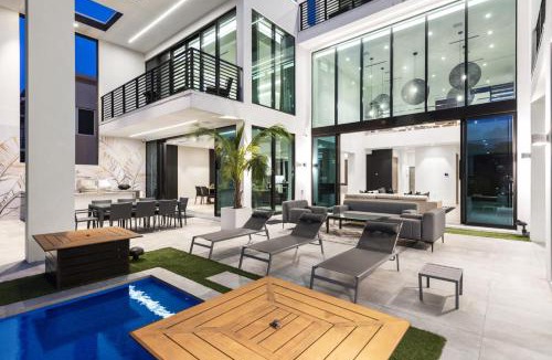 Coral Ridge House | Three Story Waterfront Villa with Basketball and Mini Golf