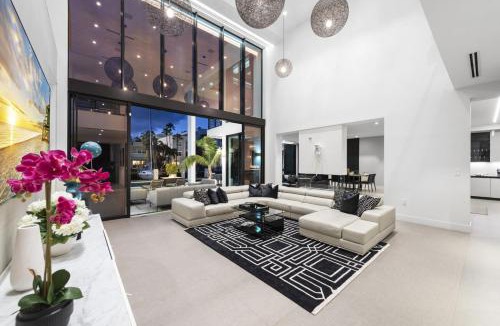 Coral Ridge House | Three Story Waterfront Villa with Basketball and Mini Golf