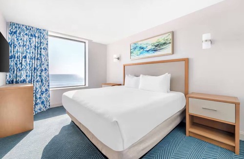 Elrod Estates Hotel | Two Coastal 2BR Units for Pool Relaxation, Ocean Walks & Family Fun