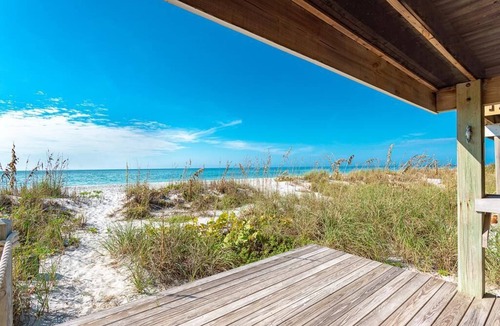 Palm Island Villa | Updated Beachfront Villa! Off the porch and onto the sand on secluded island.